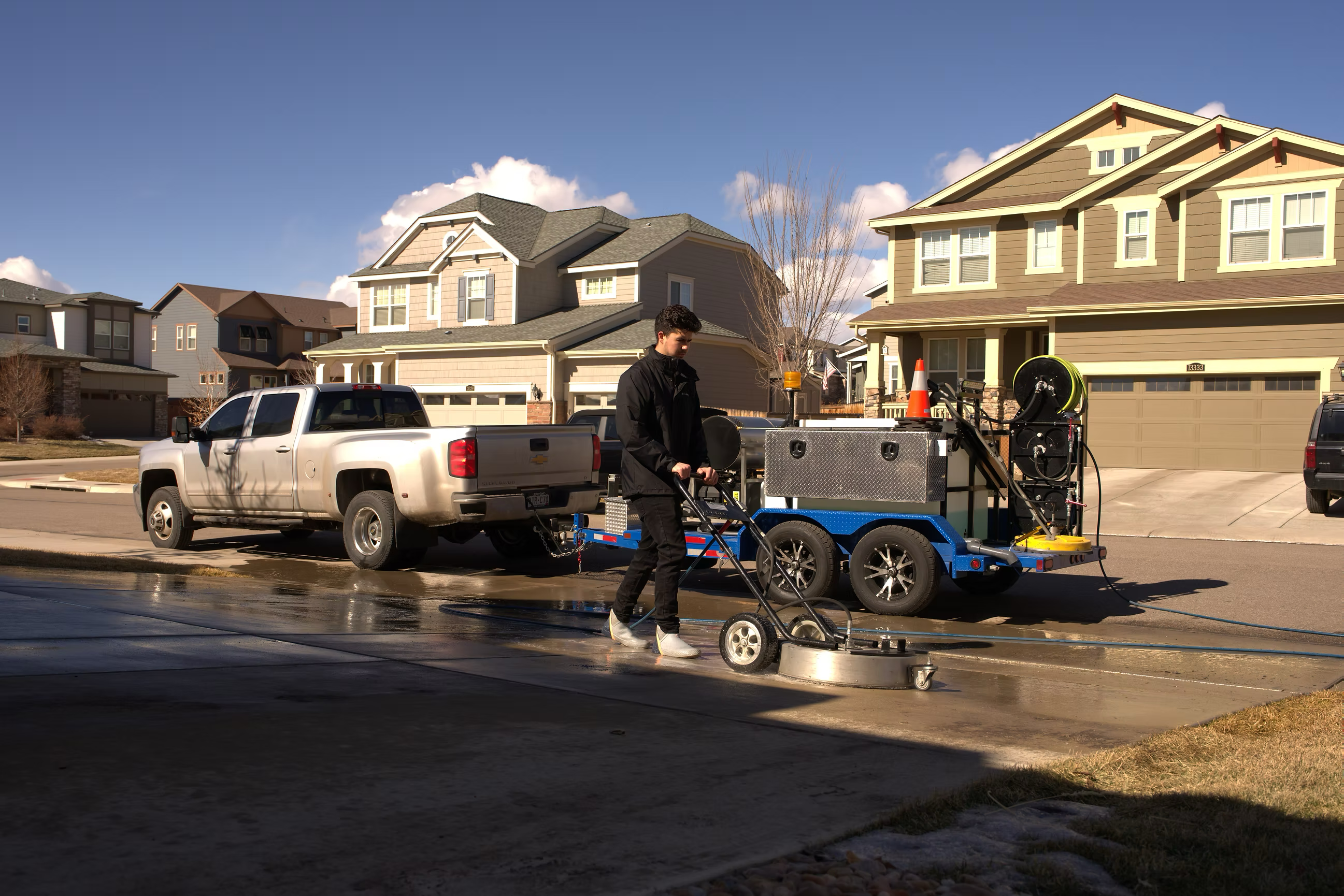 Commercial-grade surface cleaner removing stains from concrete in Colorado